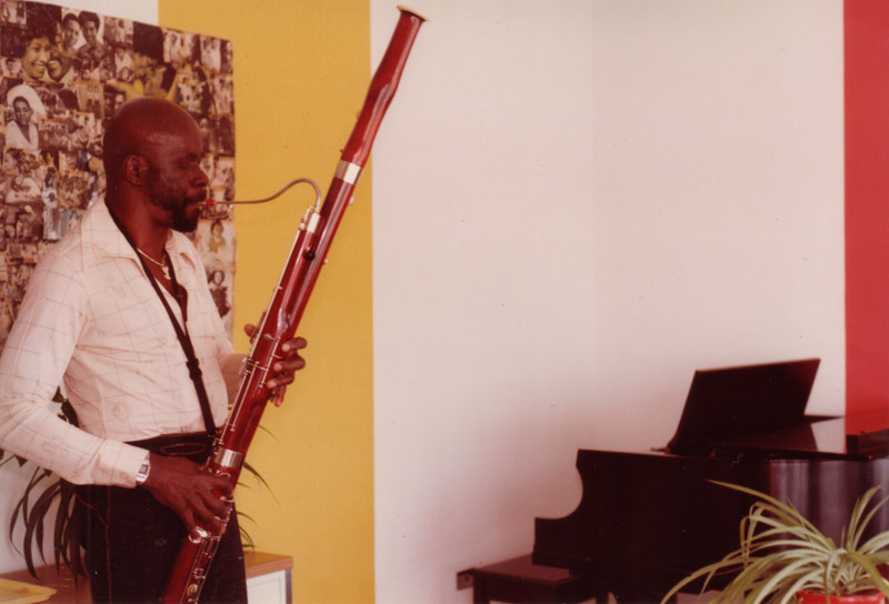 Makanda playing the bassoon in his office studio, College at Old Westbury, 1981