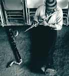 Makanda Ken McIntyre playing the flute in his Studio on West Broadway, NYC, 1980s